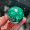 Malachite Spheres | Beautiful material from the Congo | Complex and fascinating swirls and rosettes | Pockets and caves sparkle with crystalline Malachite | Genuine Gems from Crystal Heart Melbourne Australia since 1986


