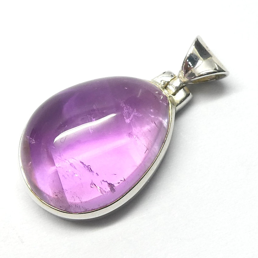 Kunzite Pendant | Teardrop Cabochon | Good colour Translucency | 925 Sterling Silver | Bezel Set | Wisdom of the Heart | Taurus Scorpio Leo | Genuine Gems from Crystal heart Melbourne Australia since 1986  