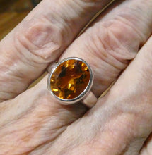 Load image into Gallery viewer, Superb AAA Grade Flawless Citrine with a beautiful deep honey colour. Faceted into an Oval shape. The main pic is in daylight which gives the truest rendition as the light box tends to wash the colour out a bit. This beautiful mellow shade is indicative of Natural Citrine rather than heated Amethyst.