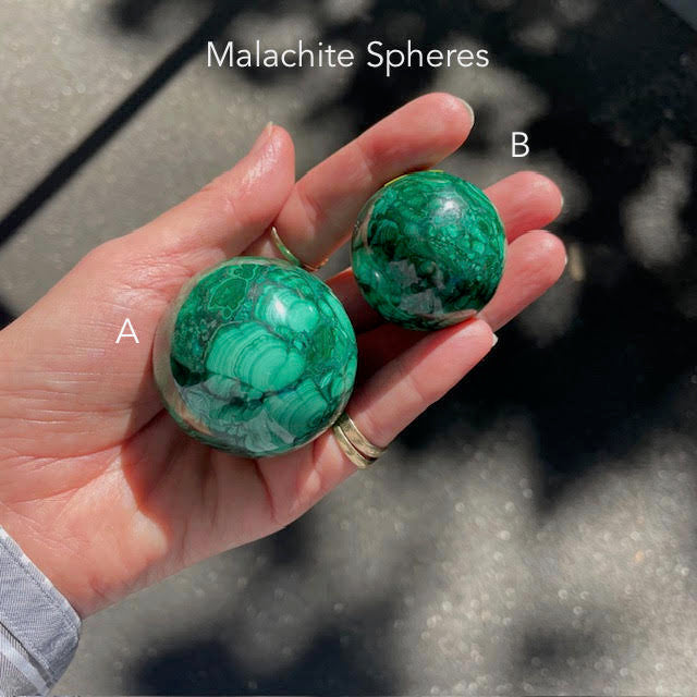 Malachite Spheres | Beautiful material from the Congo | Complex and fascinating swirls and rosettes | Pockets and caves sparkle with crystalline Malachite | Genuine Gems from Crystal Heart Melbourne Australia since 1986

