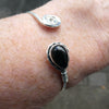 Black Onyx Gemstone Cuff Bracelet | Teardop Cabochon bezel set with detailed edging | Set on strong Silver wire ending in Celtic Spiral | Bangle Style | Bendy 925 Silver makes it adjustable Medium to Large wrist | Genuine Gemstones from Crystal Heart Melbourne Australia since 1986